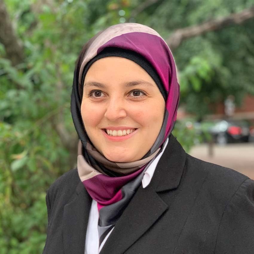 Headshot of Mona Minkara, Lebanese-American bioengineer and blind scientist from Tripoli, advocate for accessibility in STEM.